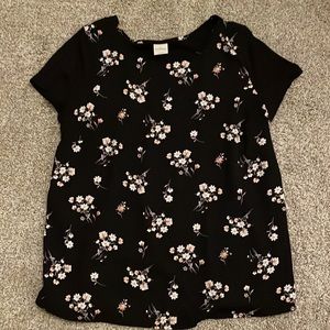 Mixed material top. Front is printed with flowers. Back is ribbed cotton